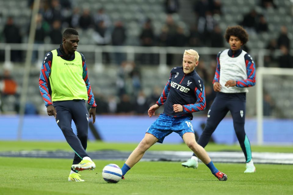 Crystal Palace players warming up before a Premier League match.