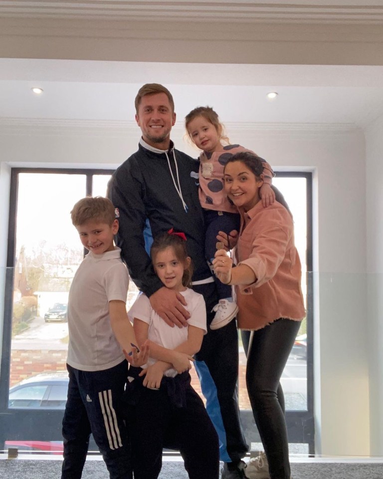 Family portrait of Jacqueline Jossa and Dan Osborne with their three children.
