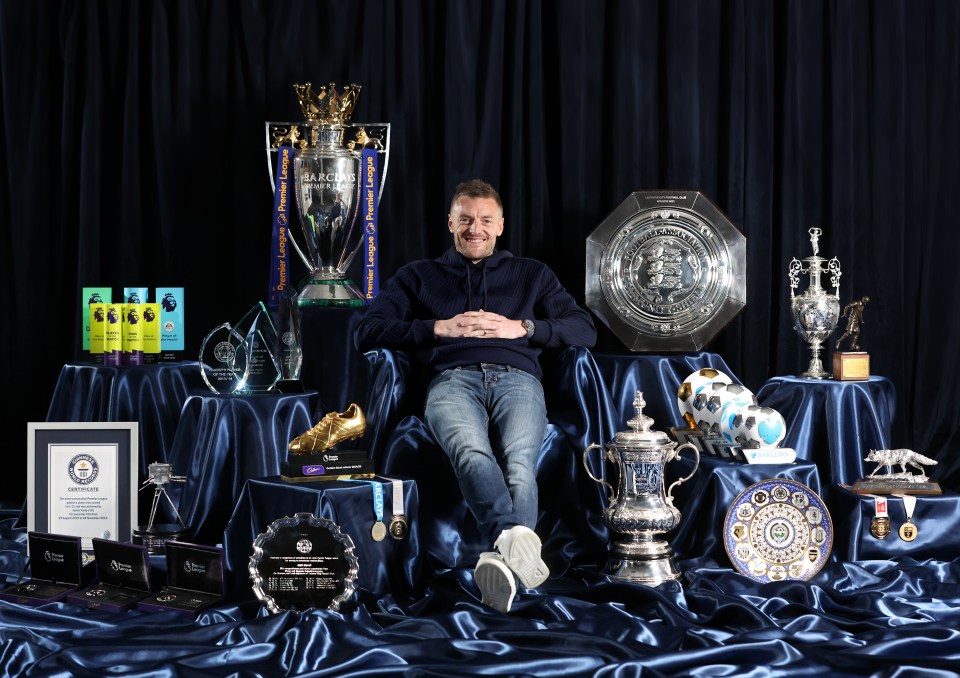 Jamie Vardy sitting among his trophies.