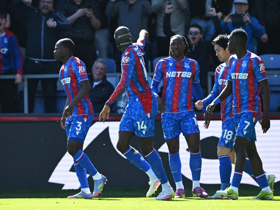 Crystal Palace soccer players celebrating a goal.