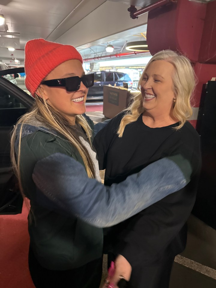 JoJo Siwa and her mother embrace at LAX.