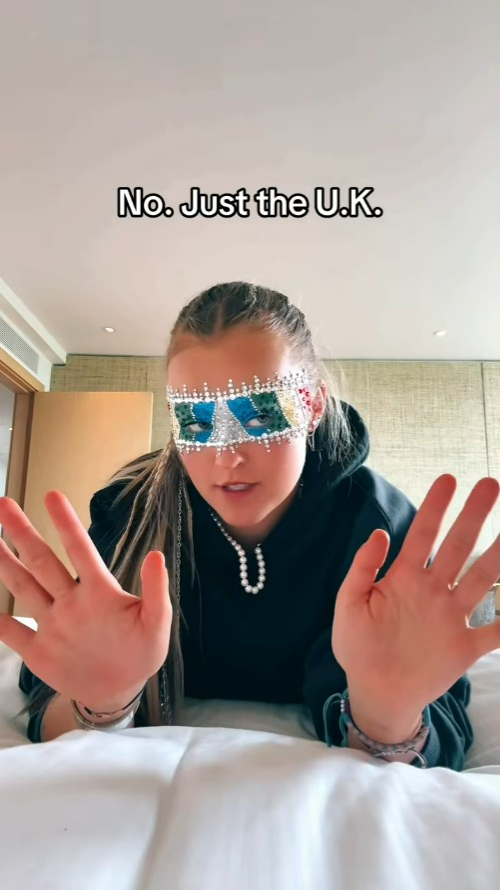 JoJo Siwa wearing a mask, saying "No. Just the U.K."