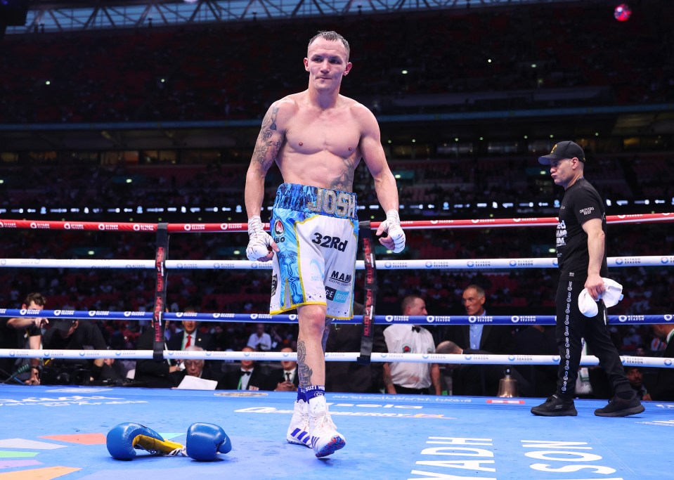Josh Warrington leaving the boxing ring after a fight.