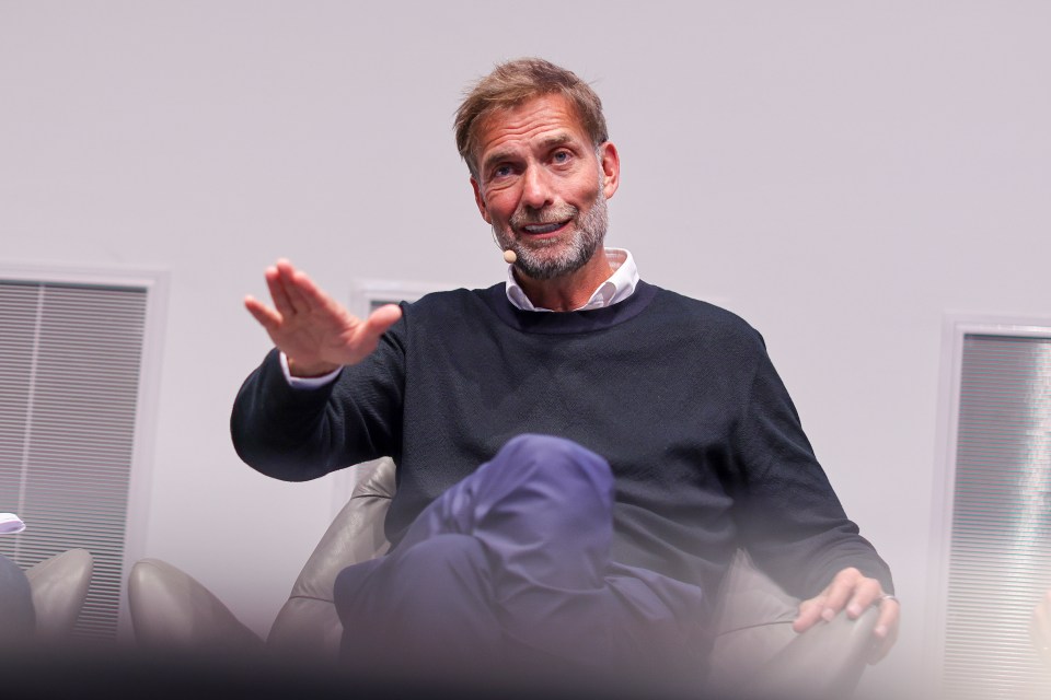 Juergen Klopp speaking at a panel discussion.
