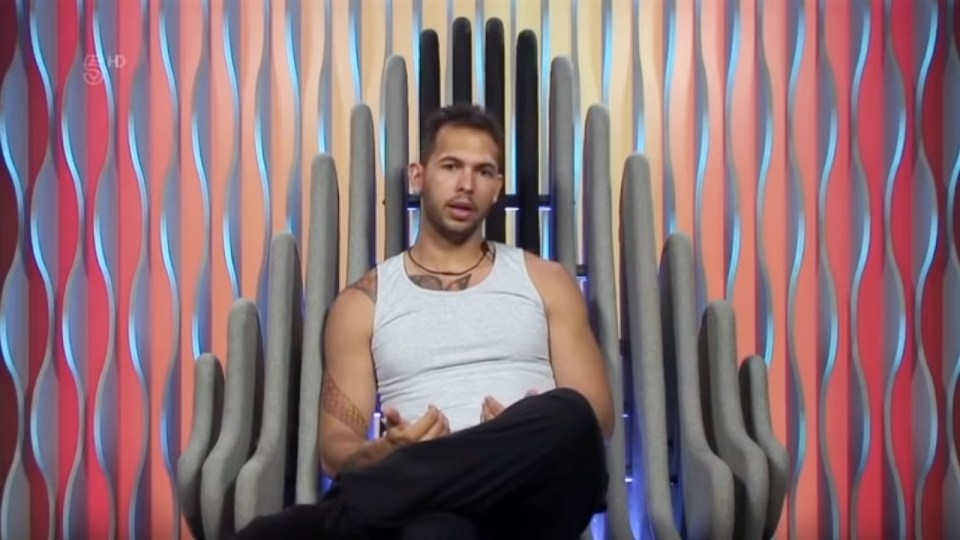 Andrew Tate sitting in a chair.