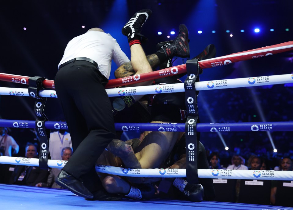 Boxers Liam Cameron and Ben Whittaker fall during a fight.