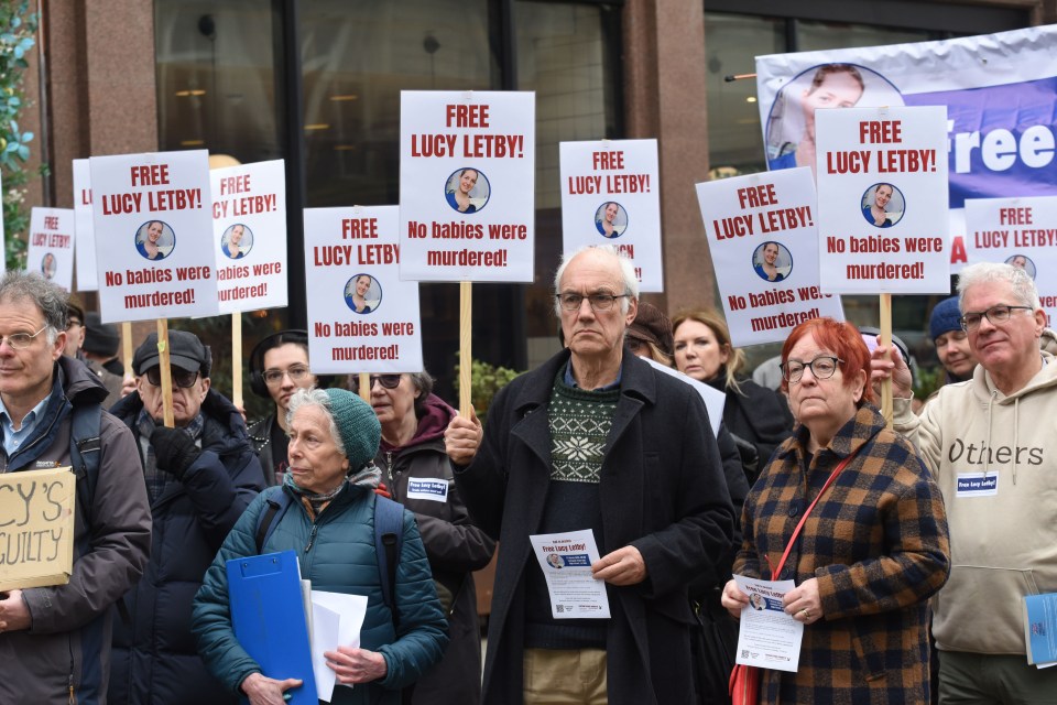 Protestors holding signs that read "Free Lucy Letby! No babies were murdered!" outside Liverpool Town Hall.