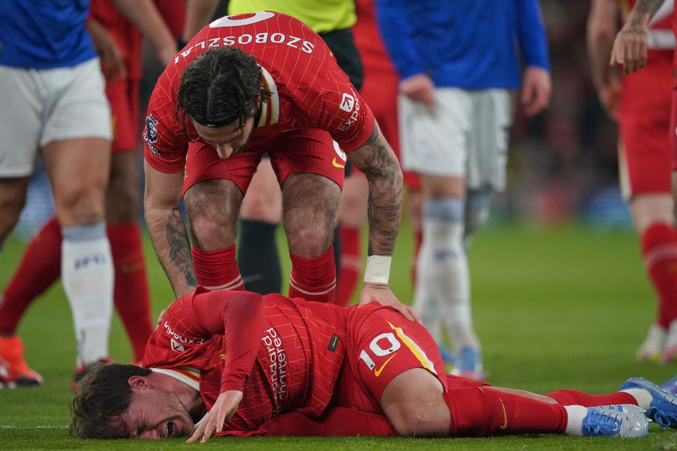 Liverpool's Alexis Mac Allister reacts after being fouled.