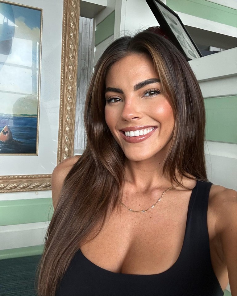Rebecca Gormley smiling and wearing a black tank top.