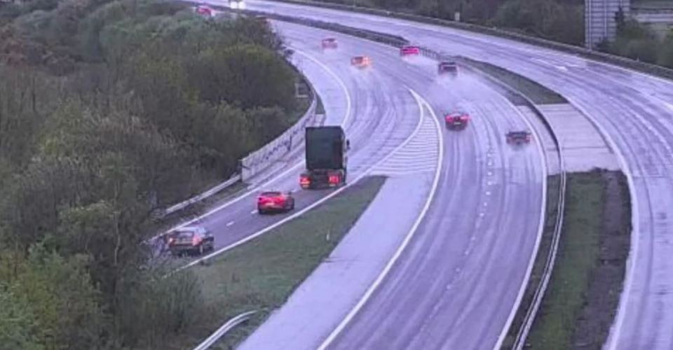 Vehicles driving on a wet highway.