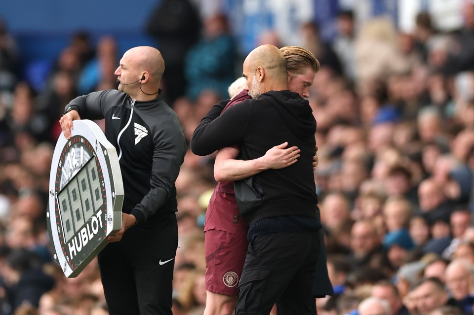 Pep Guardiola embracing Kevin De Bruyne.