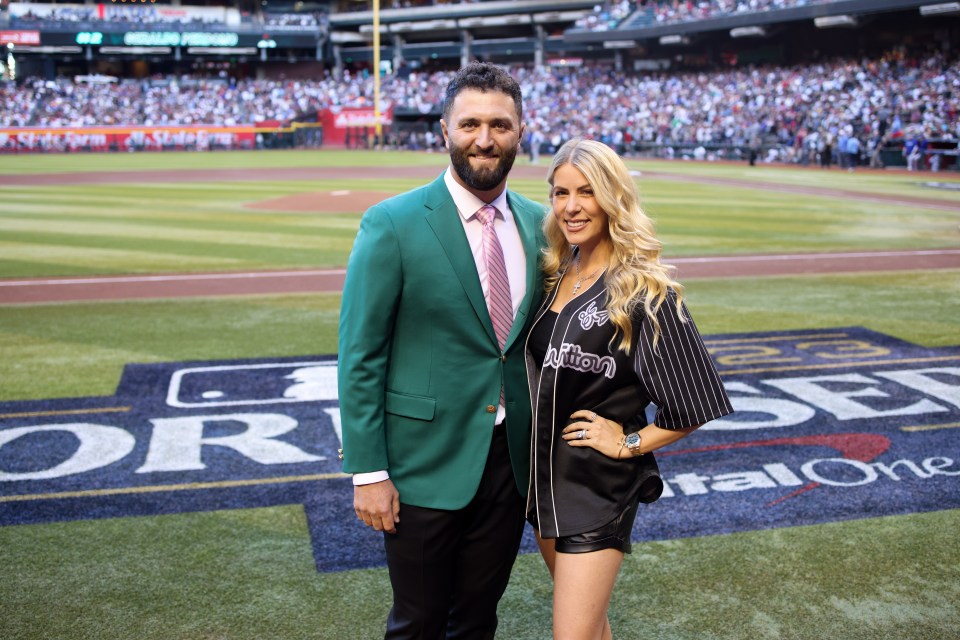 Jon Rahm and his wife at a baseball game.