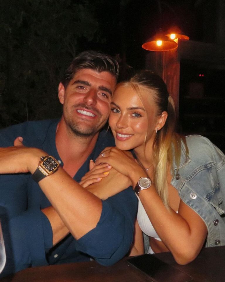 Couple embracing at night.