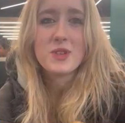 Isabelle, 16, with blonde hair, wearing a dark coat.