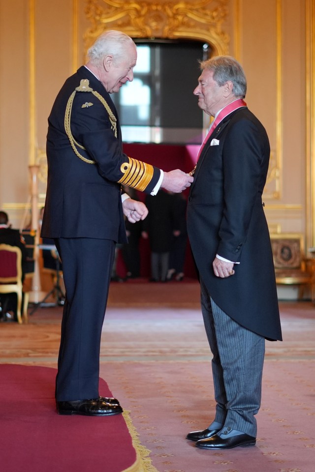 King Charles III bestowing an award on Alan Titchmarsh at Windsor Castle.