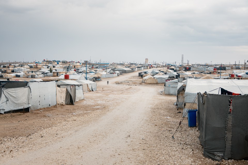 Al-Hawl camp in Syria, showing numerous tents and makeshift shelters.