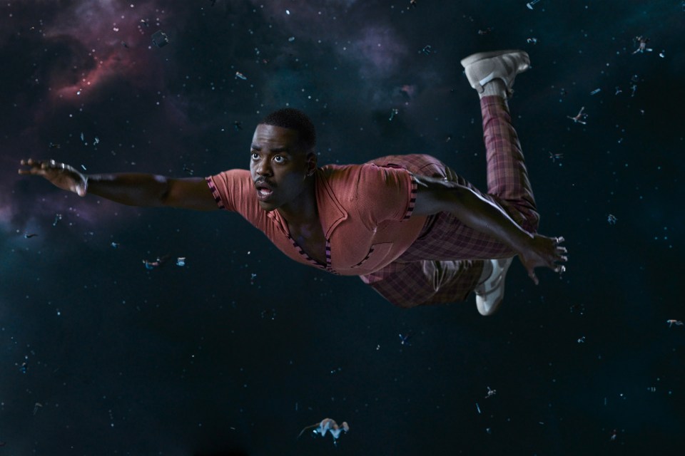 Ncuti Gatwa as the Doctor flying through space.