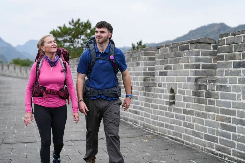 An image collage containing 1 images, Image 1 shows Two people walking along the Great Wall of China
