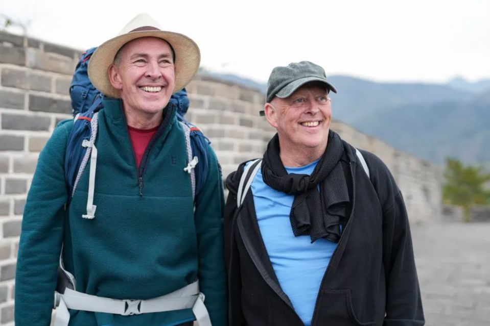 An image collage containing 1 images, Image 1 shows Two men hiking on the Great Wall of China