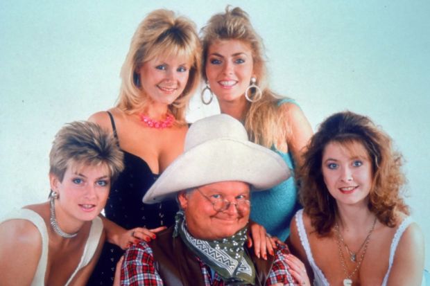An image collage containing 1 images, Image 1 shows Benny Hill with four women from the Benny Hill Show