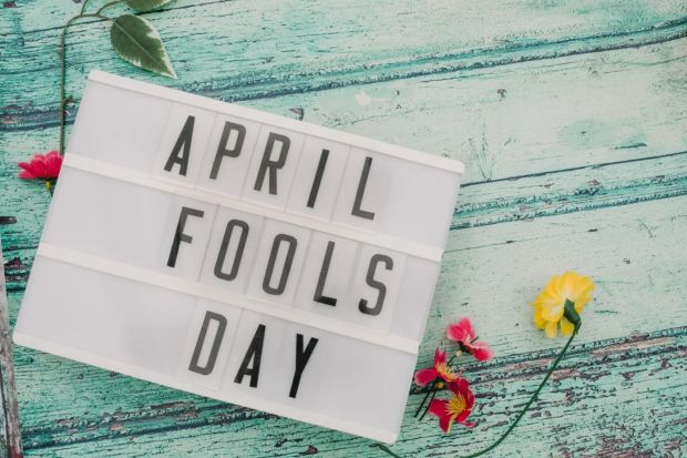 An image collage containing 1 images, Image 1 shows Lightbox displaying &quot;April Fools Day&quot; on a teal wooden background