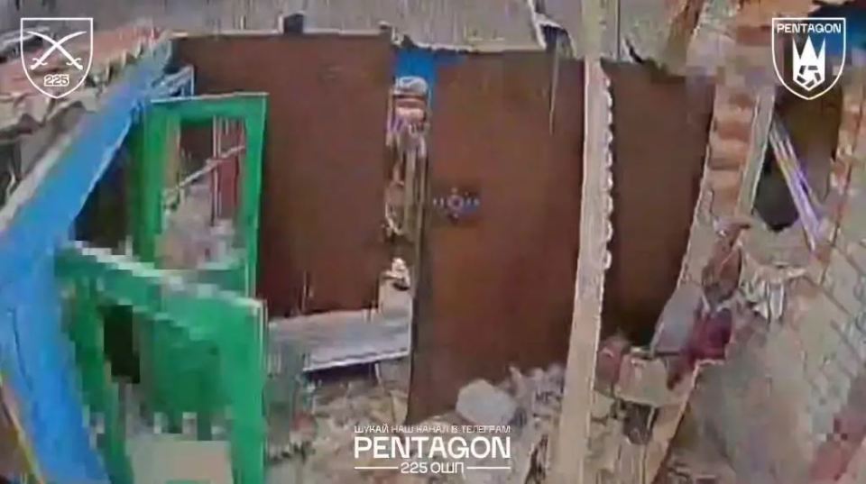 First-person drone footage of a destroyed building.
