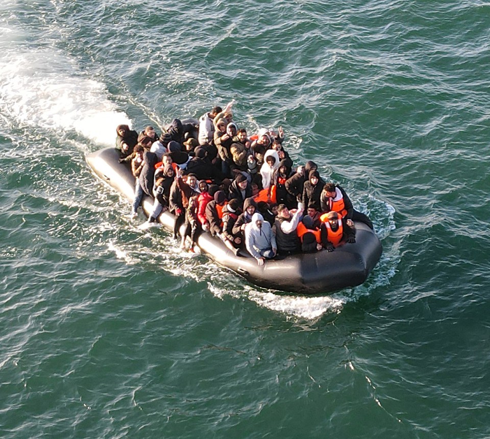 Overcrowded migrant dinghy in the English Channel.