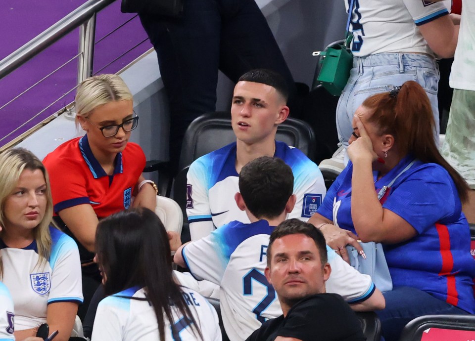 Phil Foden with his mother and girlfriend at a FIFA World Cup match.