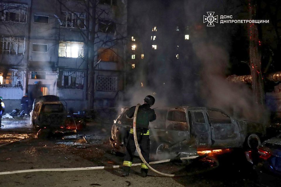 Firefighters extinguishing a fire after a Russian attack in Dnipro.
