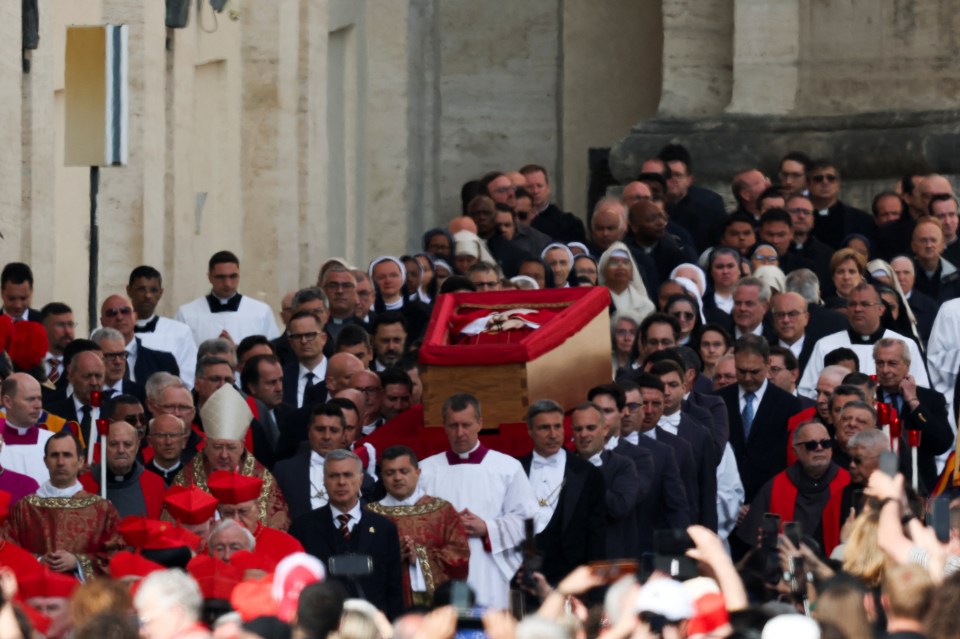Pope Francis's coffin being carried into St. Peter's Basilica.