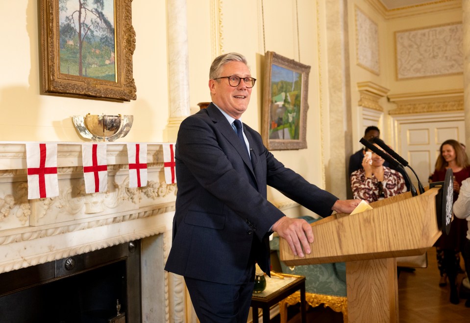 Prime Minister speaking at a podium.