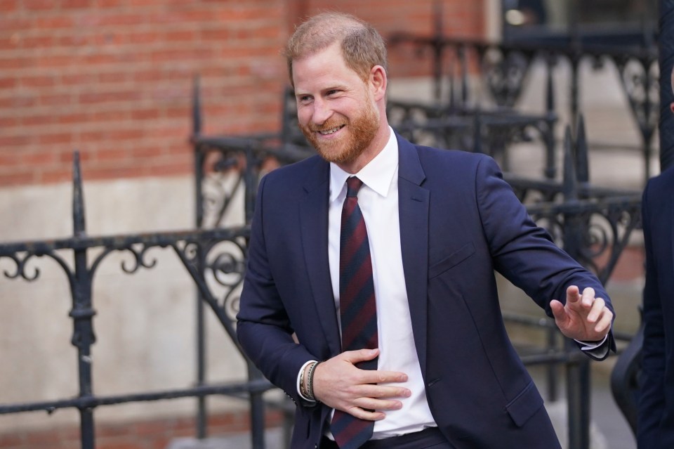 Prince Harry waving as he leaves the Royal Courts of Justice.