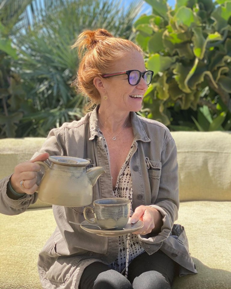 Woman pouring tea into a cup.