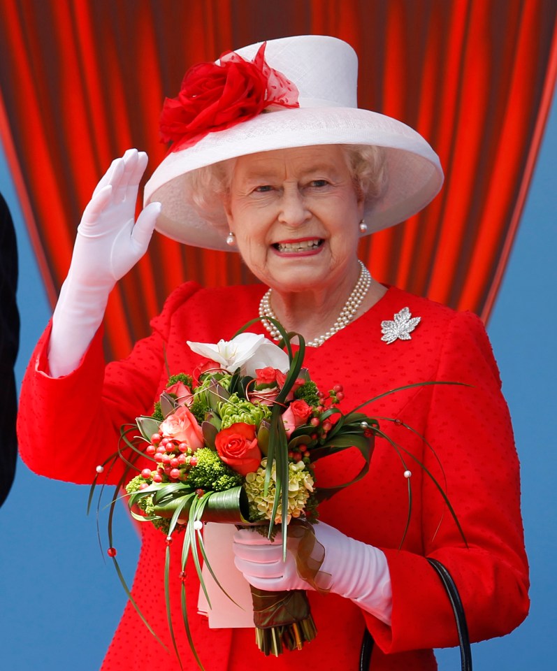 Queen Elizabeth II waving to a crowd in Ottawa, Canada.