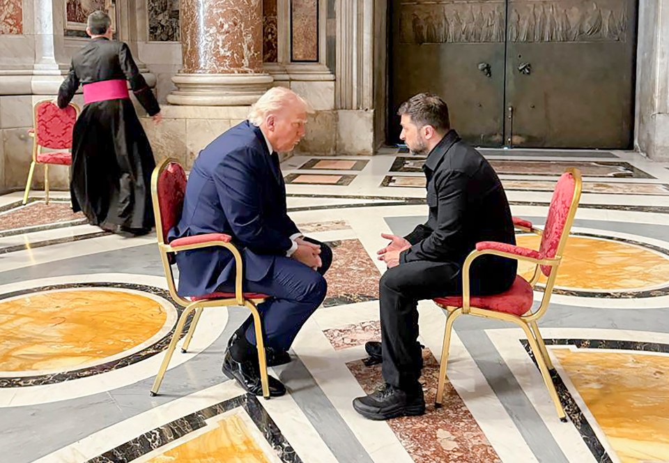 Donald Trump and Volodymyr Zelenskyy seated in chairs, in conversation.