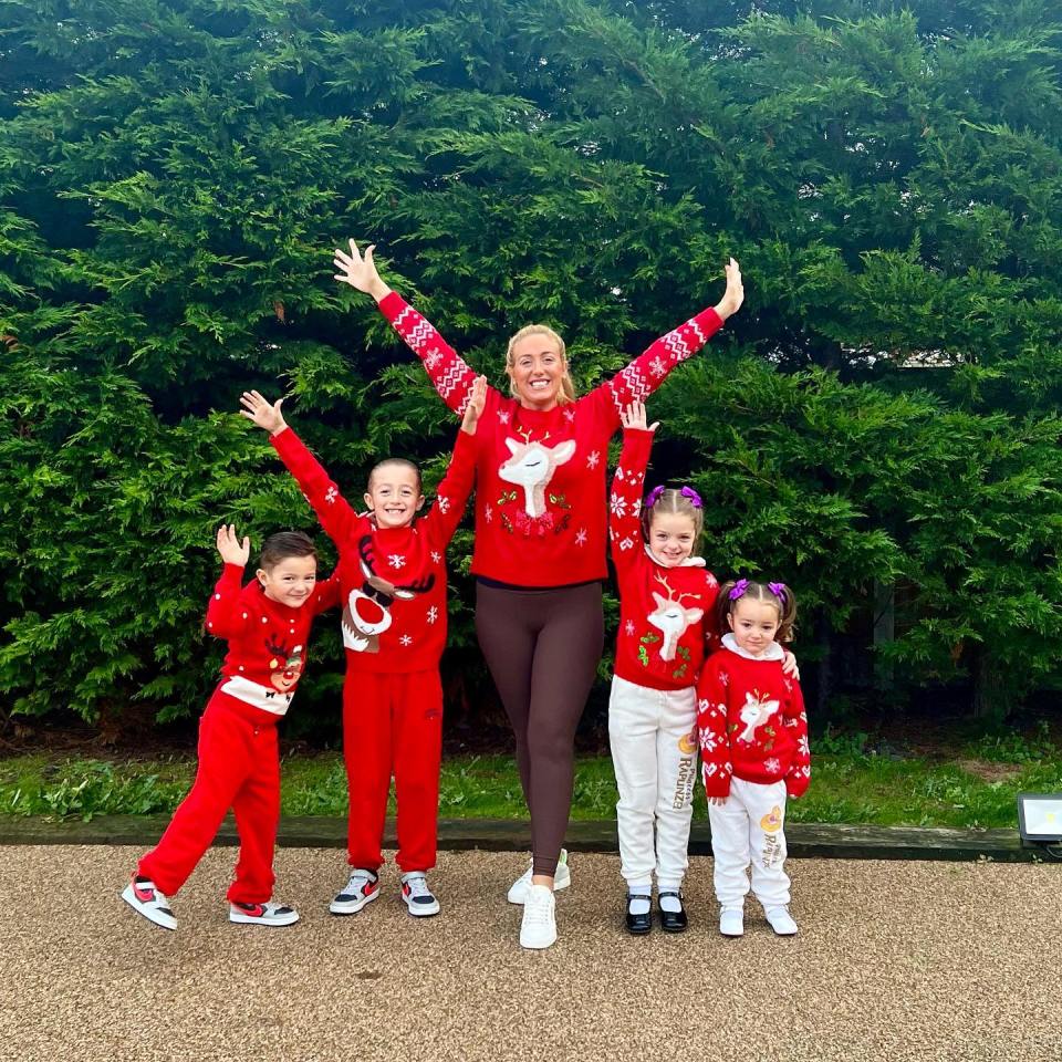 Family in matching Christmas sweaters.