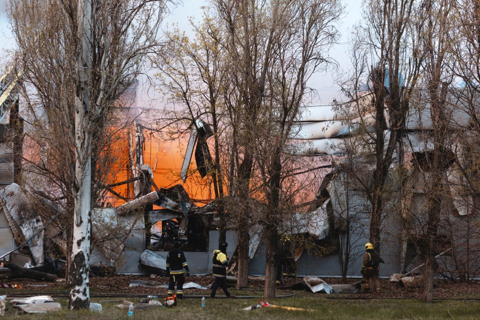 Firefighters at the site of a bombed factory in Dnipro, Ukraine.