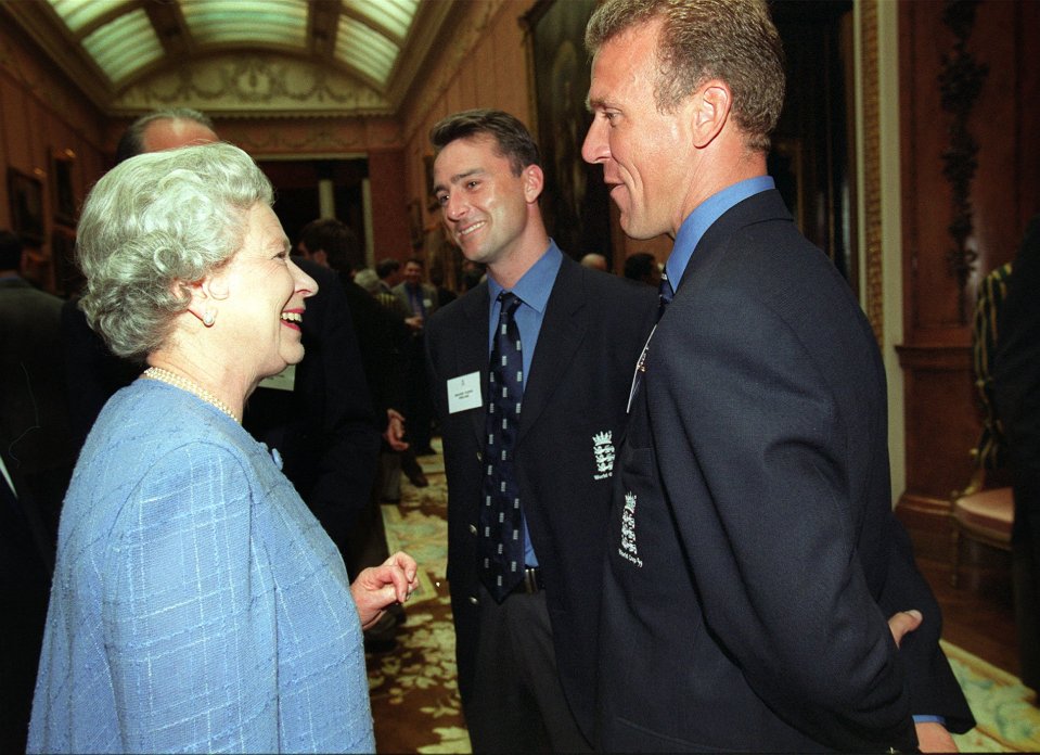 The Queen speaking with two England cricket players at Buckingham Palace.