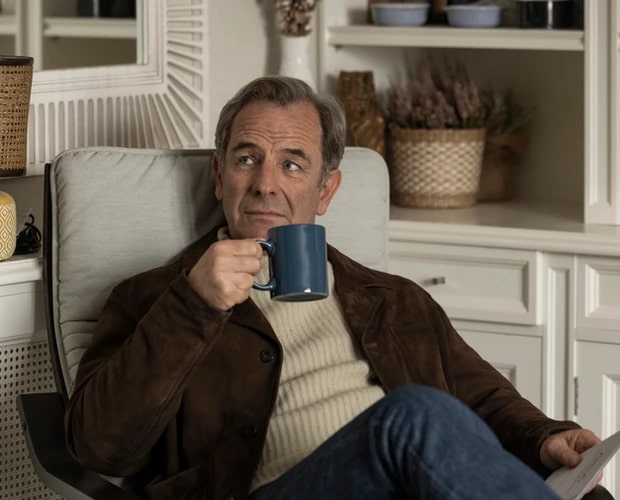 Robson Green holding a mug in a new thriller series, "Catch You Later".