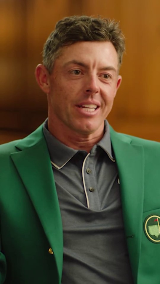 Rory McIlroy in a green jacket.