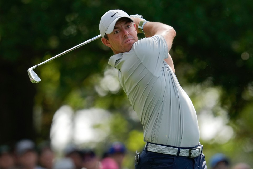 Rory McIlroy hitting a golf ball.
