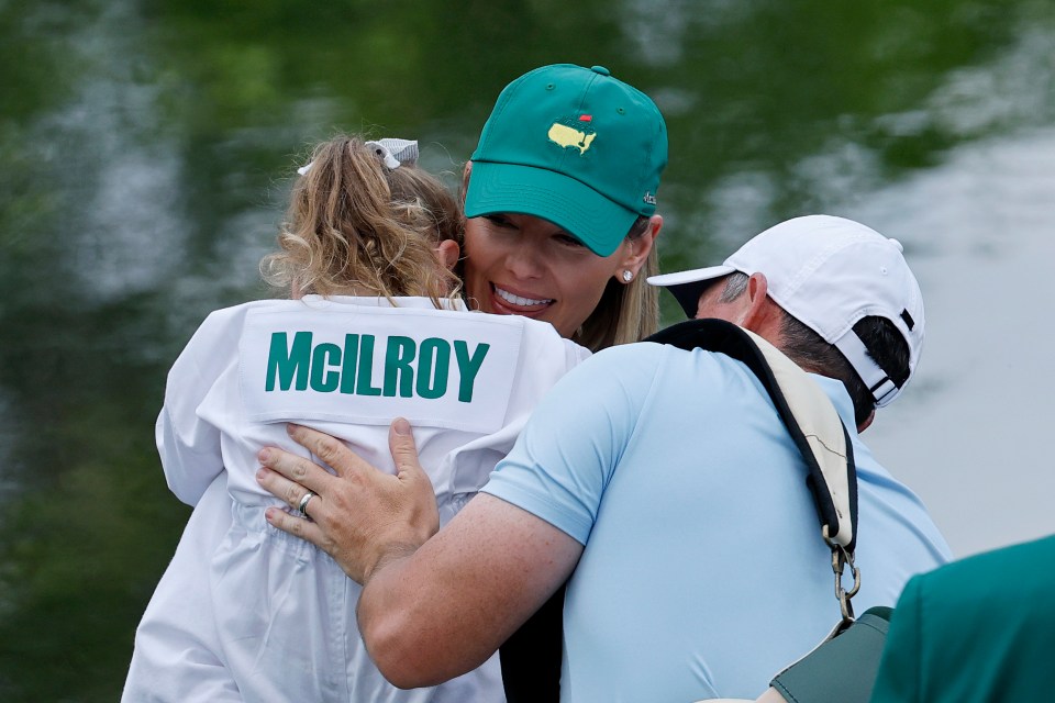 Rory McIlroy embracing his wife and daughter.