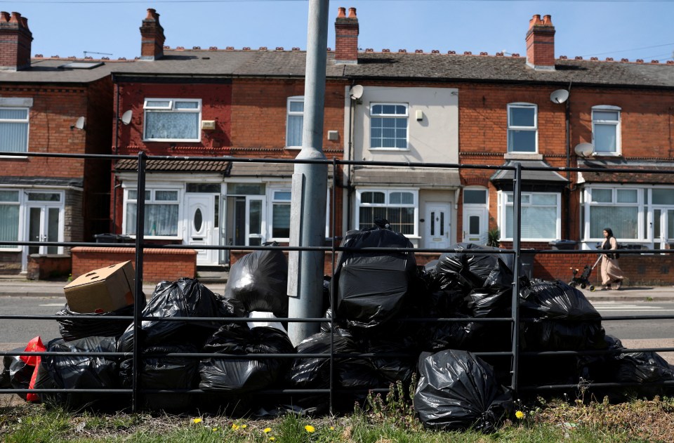 Pile of garbage bags on a street during a strike.
