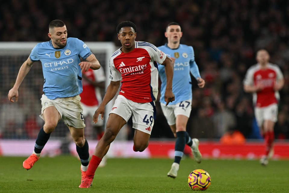 Arsenal midfielder Myles Lewis-Skelly running with the ball during an English Premier League match.