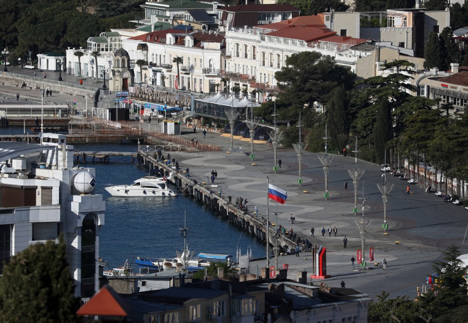 Russian flag flying on a Yalta embankment.