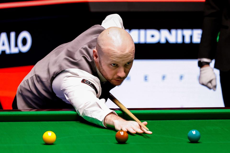 Zak Surety playing snooker.
