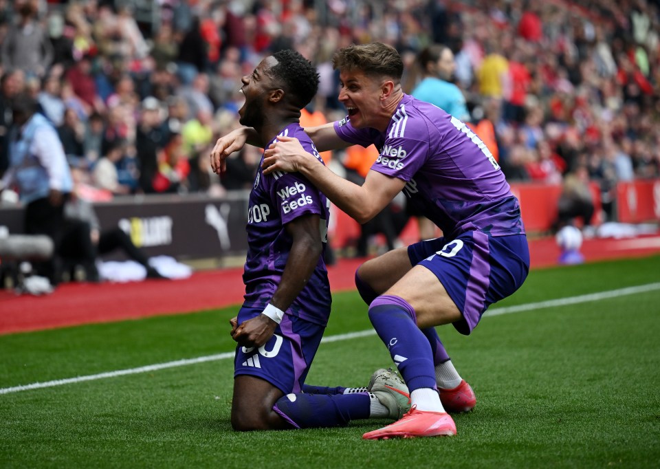 Fulham players celebrating a goal.
