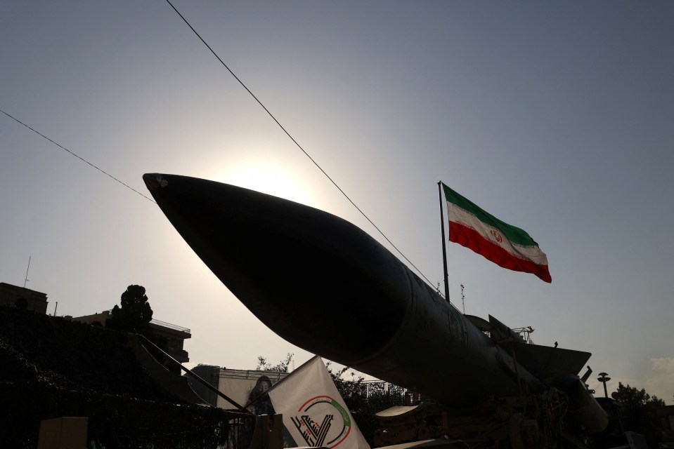 Silhouette of an S-200 missile system with an Iranian flag.