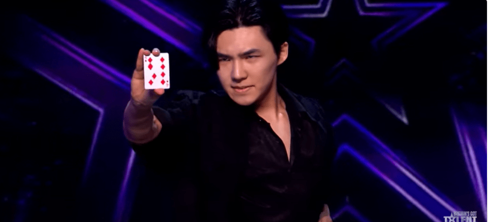 Magician showing a card on Britain's Got Talent.