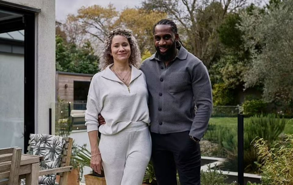 Couple standing outside their allergy-proof house.
